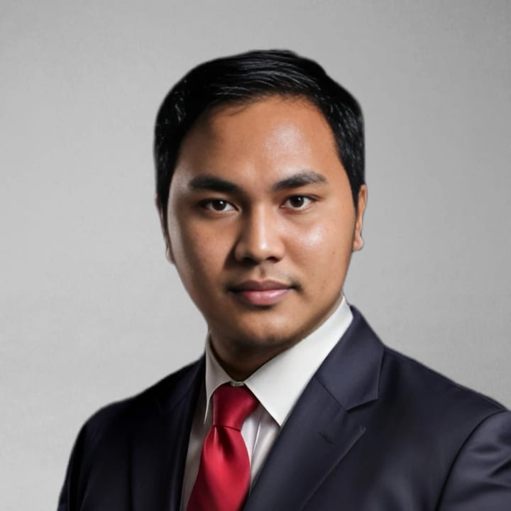 Portrait of Hanif Muhamad Zein in a dark suit and red tie
